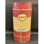 An Esso grease drum of large size.