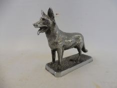 A well defined accessory mascot in the form of a standing alsation dog.