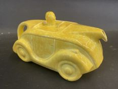 An Art Deco Sadler teapot in the form of a streamlined motor car, yellow version.