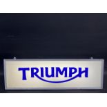 A Triumph illuminated lightbox, 25 1/4 x 8 x 6".