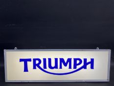 A Triumph illuminated lightbox, 25 1/4 x 8 x 6".