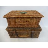 Two wicker picnic baskets, one bearing Land Rover/Range Rover branding.