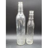 Two Solvol glass oil bottles.