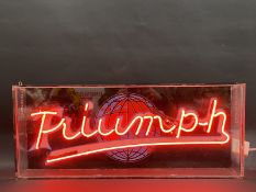 A contemporary neon lightbox advertising Triumph, 31 1/2" w x 13 1/4" h x 3" d.