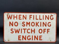 A garage forecourt 'No Smoking' pressed aluminium sign by Hills, 23 x 13".