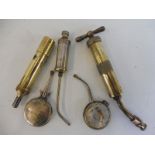 A selection of grease guns and oil tins to include Enots and Lucas.