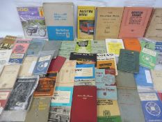 Two boxes of assorted motoring manuals to include Austin, Jaguar, Bedford, Morris etc.