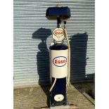 A Bowser hand operated petrol pump, restored in Esso livery, with rubber hose and nozzle.