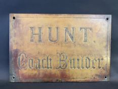 An unusual 'Hunt Coach Builder' brass name plaque, 18 x 12".