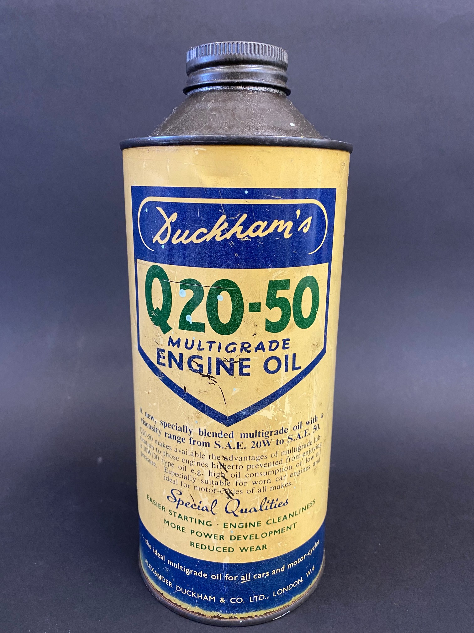 A Duckham's Q20-50 Multigrade Engine Oil cylindrical quart can.