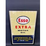 An original Esso Extra Motor Oil advertisement, framed and glazed, 21 1/2 x 31 1/2".