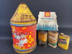 A Sternol five gallon drum, three quart cans and a Shell Anti-Freeze tin sign.