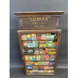 A Lumax British Bulbs wall mounted single door dispensing cabinet with contents.