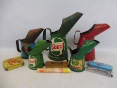 A box of oil measures including a Castrol quart and a half pint, plus puncture repair kits etc.