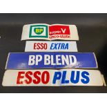 A group of four different petrol pump brand stickers etc.