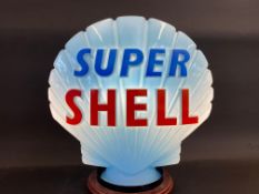 A blue Super Shell glass petrol pump globe by Hailware, bright lettering, two minor chips to rim