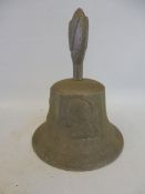 An aluminium bell cast in metal from a German aircraft shot down in WWII, marked RAF Benevolent