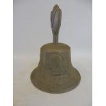 An aluminium bell cast in metal from a German aircraft shot down in WWII, marked RAF Benevolent