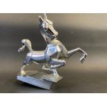 An unusual Art Deco chrome plated mascot in the form of a horse with its two front legs raised.