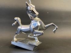 An unusual Art Deco chrome plated mascot in the form of a horse with its two front legs raised.