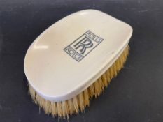 A Rolls-Royce clothes brush, stamped Harrods of London, Made in England.