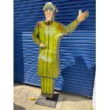 A tall American tin freestanding double sided garage forecourt attendant, with moving arm to draw