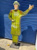 A tall American tin freestanding double sided garage forecourt attendant, with moving arm to draw