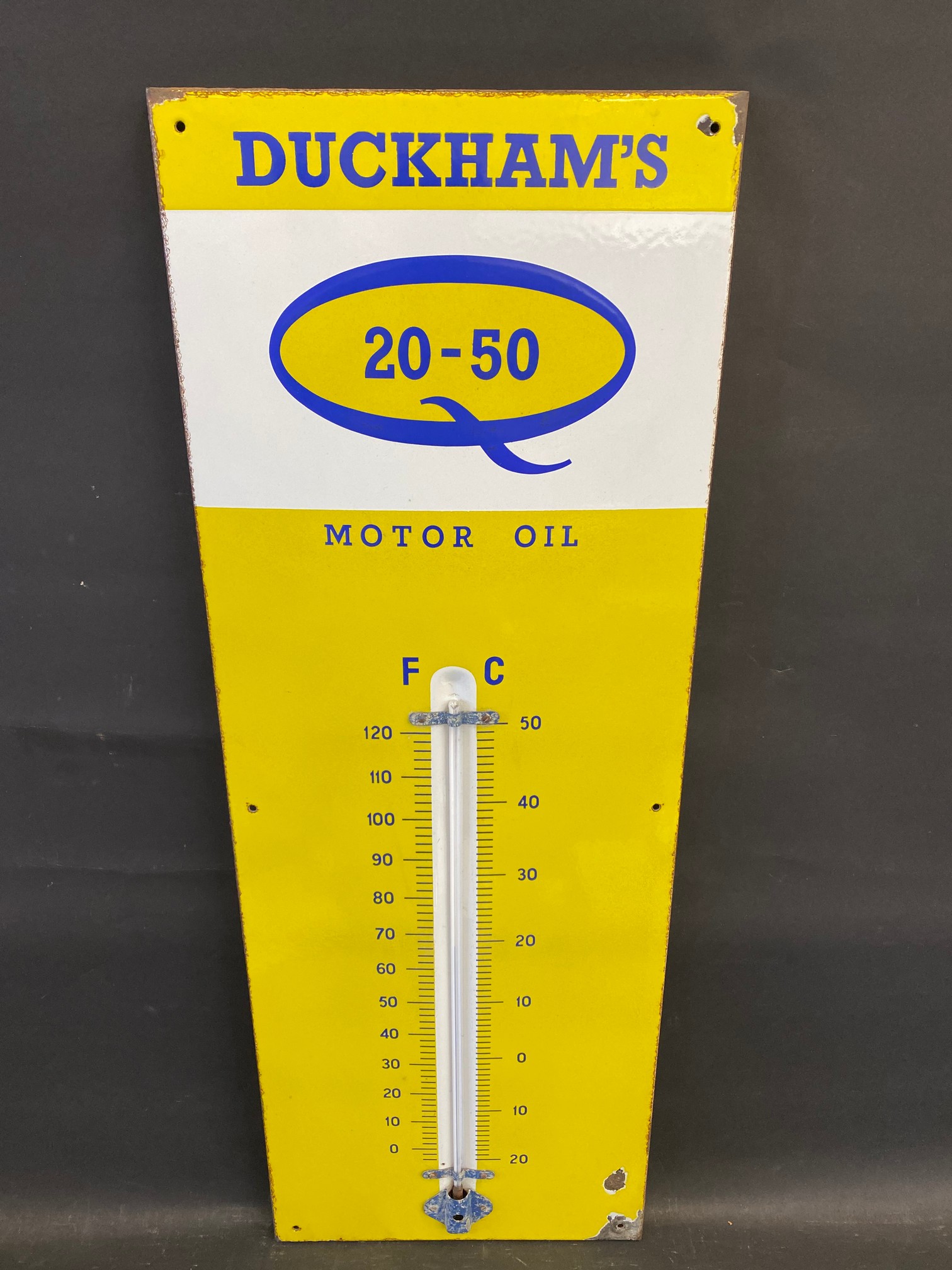 A Duckham's 20-50 Motor Oil enamel thermometer in very good condition, complete with working tube,