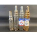 Four assorted Esso oil bottles.