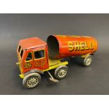 A British clockwork tinplate articulated fuel tanker with Shell-Mex & BP Ltd advertising.
