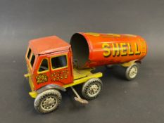 A British clockwork tinplate articulated fuel tanker with Shell-Mex & BP Ltd advertising.