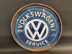 A contemporary VW Service circular metal sign, 24" diameter.
