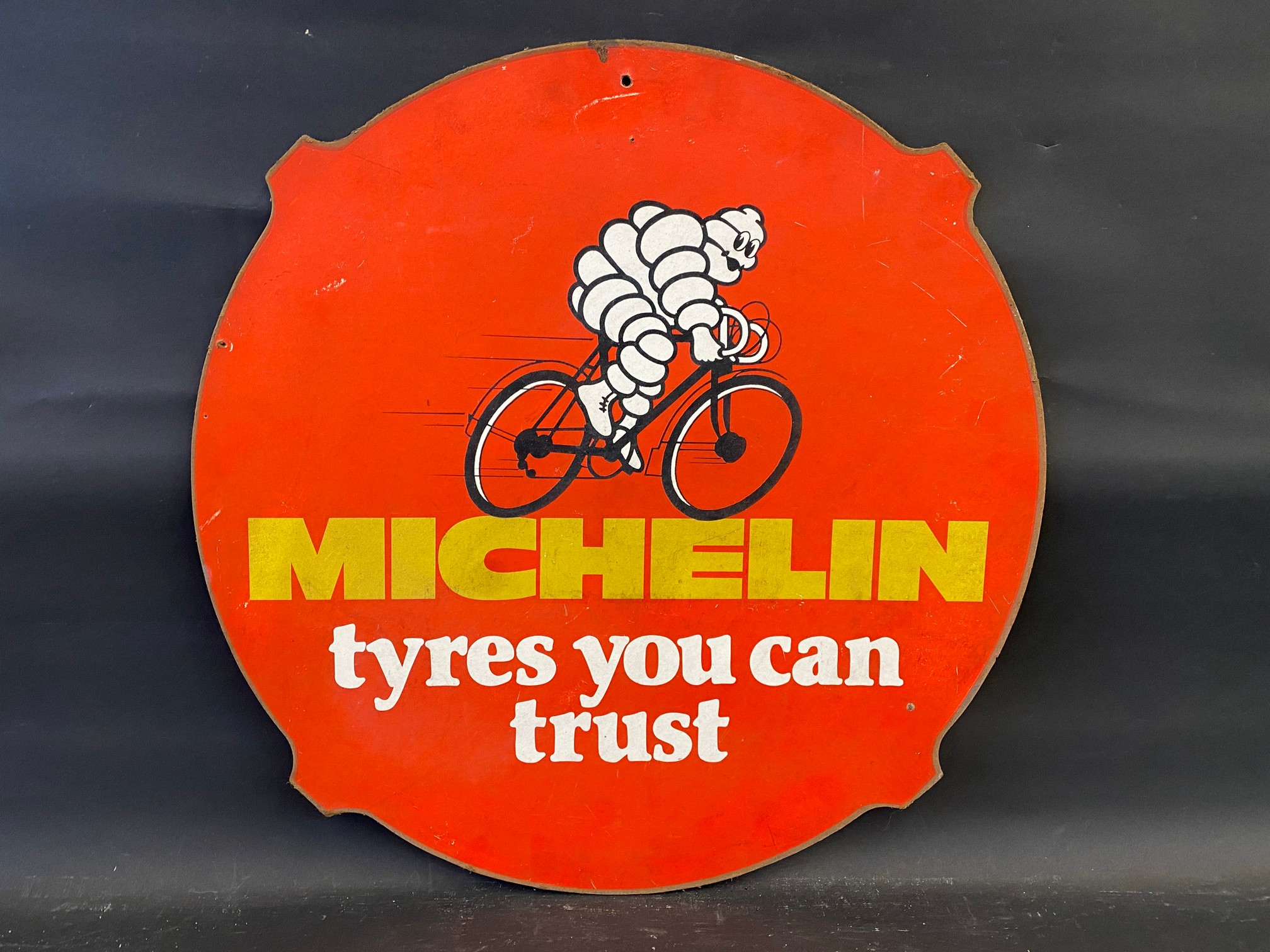 A Michelin bicycle pictorial hardboard advertising sign, 24" diameter.