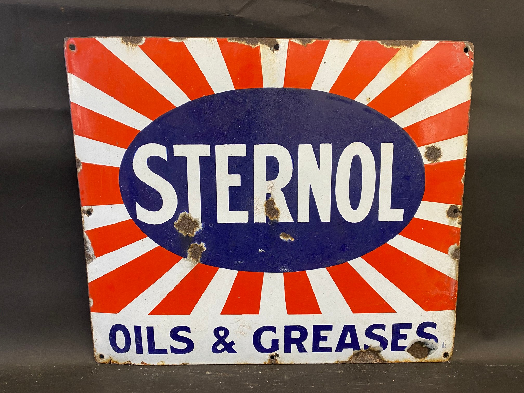 A Sternol Oils & Greases enamel sign, 21 x 18".