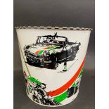 A waste paper bin decorated with various aspects of motor sport, 7" high.