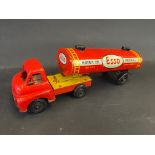 An Esso tinplate model of an articulated petrol tanker bearing Esso livery.