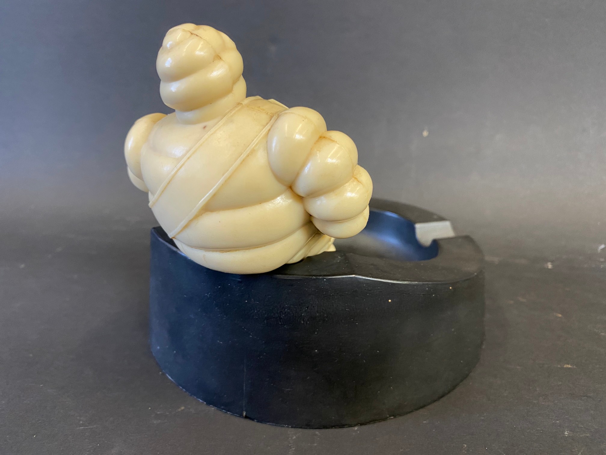 A Michelin bakelite ashtray surmounted by a seated Mr. Bibendum. - Image 2 of 3