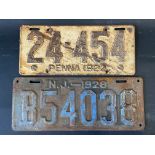 Two vintage American number plates, the first from Pennsylvania 1922, the other New Jersey 1928.