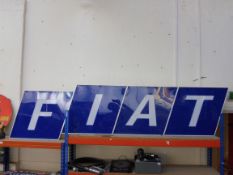 A large FIAT four piece garage showroom illuminated sign by Bloom Signs, each letter formed as an
