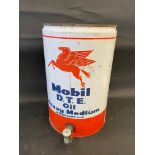 A Mobil D.T.E. Oil five gallon drum with dispensing tap.