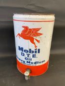 A Mobil D.T.E. Oil five gallon drum with dispensing tap.