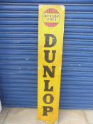 A Dunlop Stock aluminium advertising sign, 11 1/4 x 59 1/4".