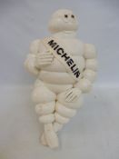 A Michelin Mr Bibendum figure on bracket, 1966 Made in France.