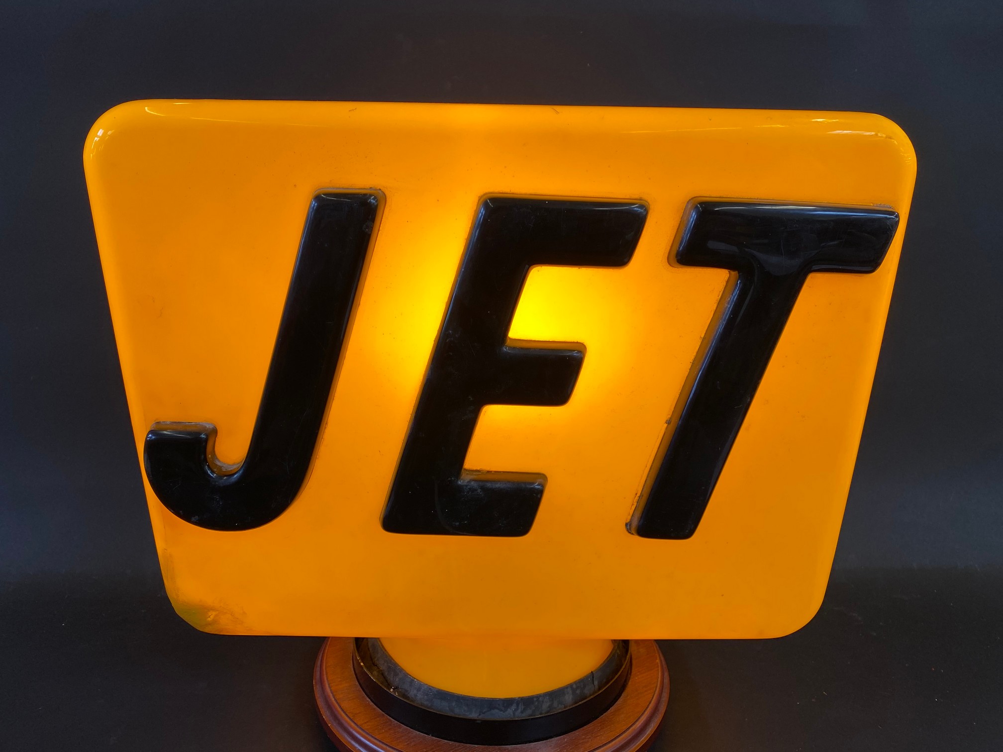 A Jet yellow plastic petrol pump globe, repaired damage.