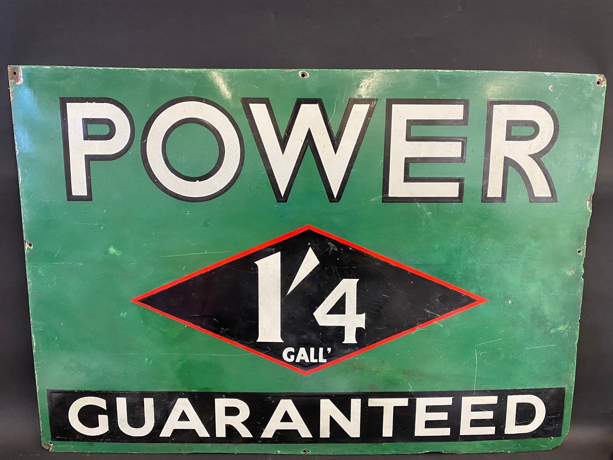 A Power Guaranteed '1'4 Gall' rectangular enamel sign, with some restoration, 40 x 27 1/2".