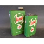 A Castrol Gear oil quart can plus a Motor Oil XXL grade pint can.