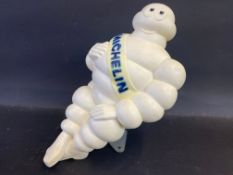 A Michelin air tower advertising plastic seated Mr. Bibendum figure.