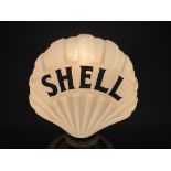 A very rare Shell clam-shaped oil globe **CATALOGUE AMENDMENT - the neck has five small chips under