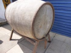 An early Russian Oil Products Ltd galvanised bulk barrel on original stand.