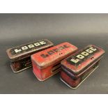 Three Lodge spark plug tins.